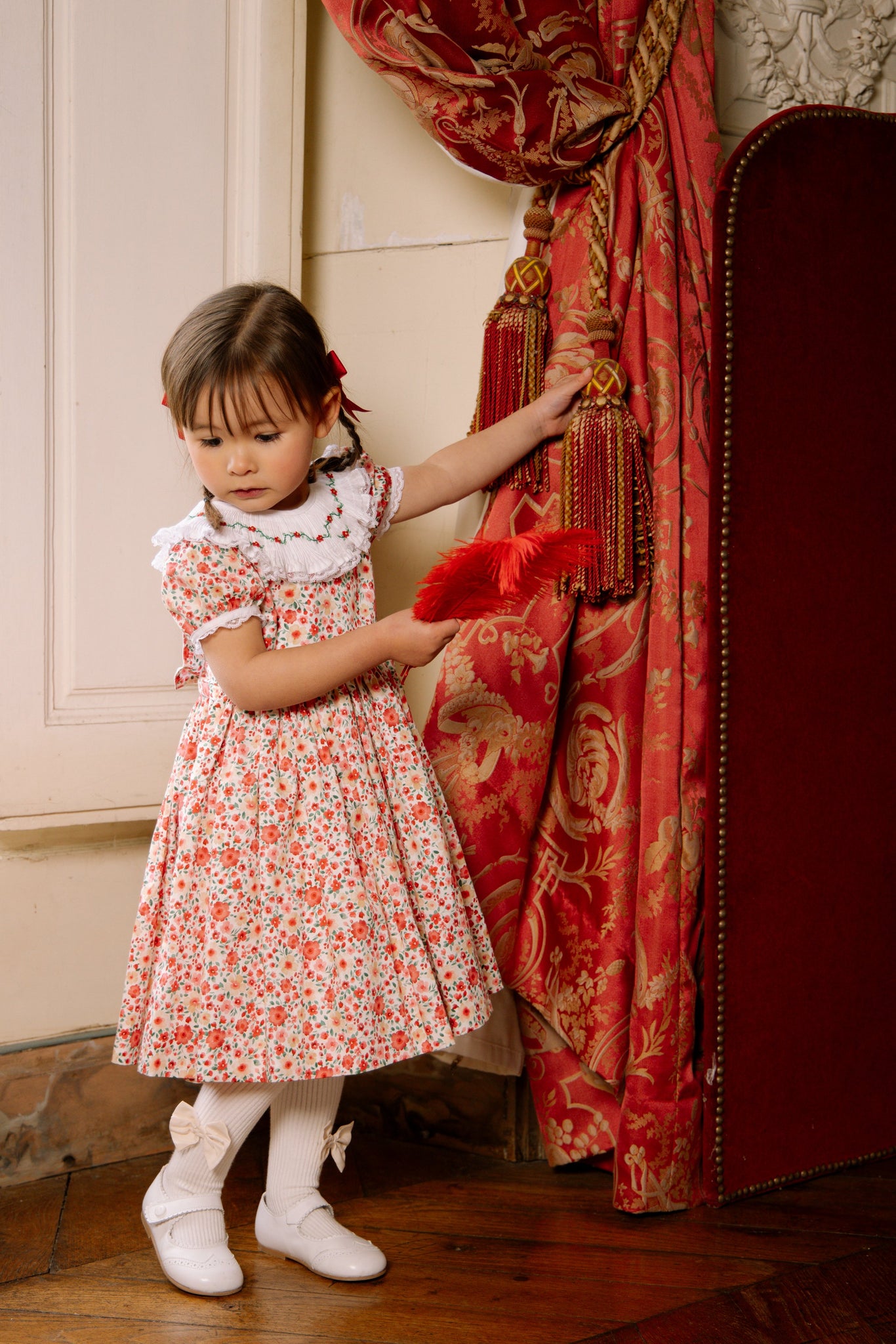 Girl wearing Celestine Red Floral Smocked Dress