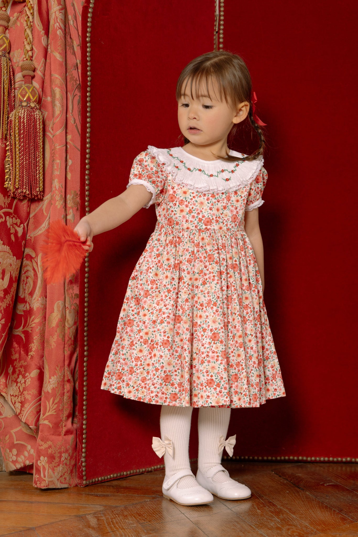 Girl wearing Celestine Red Floral Smocked Dress