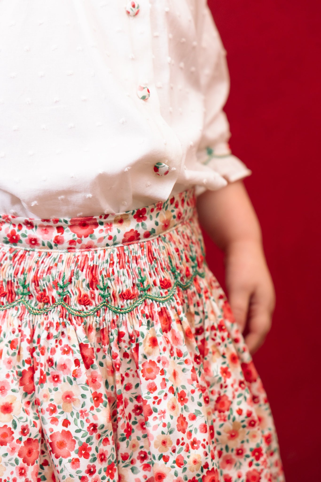 Close-up of details on Marie Red Floral Smocked Skirt and Blouse Set